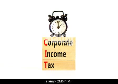 CIT corporate income tax symbol. Concept words CIT corporate income tax on wooden blocks on a beautiful white table white background. Business and CIT Stock Photo