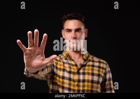 Caucasian man on black background Stock Photo