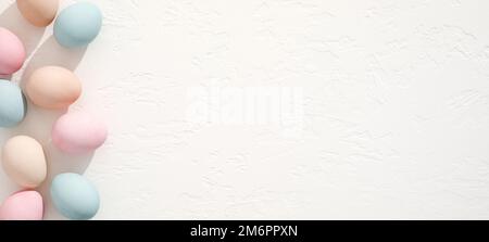 Colorful eggs on white texture. Easter background Stock Photo