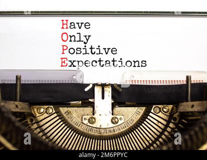 HOPE have only positive expectations symbol. Concept words HOPE have only positive expectations on typewriter on beautiful white background. Business Stock Photo