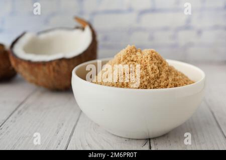 coconut sugar in a white bowl on table  Stock Photo