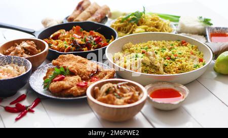 Chinese food set. Chinese noodles, fried rice with chicken, shrimps, spring rolls, deep fried crispy chicken Stock Photo