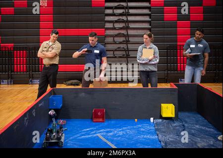 220504-N-WF272-1042 LANCASTER, Pa. (May 4, 2022) Judges for the robotics completion observe a land robot performance during the the Sea, Air and Land Challenge held at J.P. McCaskey High School in Lancaster, Pennsylvania, May 4, 2022. The Sea Air and Land Challenge is an Office of Naval Research sponsored program, in which teams of high school students learn about the engineering process through the design and build of robotic systems. The systems are then used to compete in challenges relevant to the Department of Defense, which mimic missions encountered by the military, national security ag Stock Photo