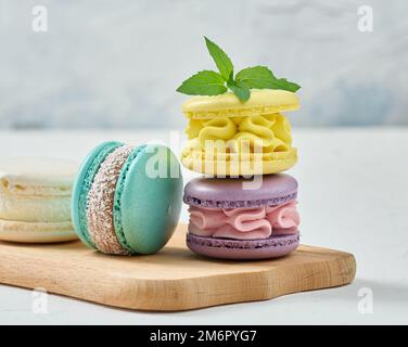 Stack of colorful macaroons on white background Stock Photo