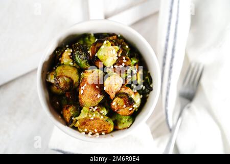 Roasted Teriyaki Brussels sprouts served in a bowl, selective focus Stock Photo