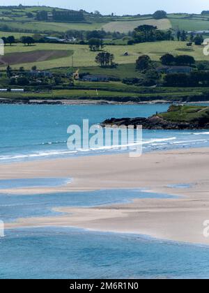 Inchydoney beach at low tide on a sunny spring day. The famous Irish beach on the south coast of the country. Seaside landscape. Stock Photo