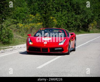 FERRARI 488 SPIDER 2017 on an old racing car in rally Mille Miglia 2022 the famous italian historical race (1927-1957 Stock Photo
