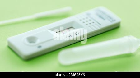 Positive test result by using rapid test device for COVID-19. Stock Photo