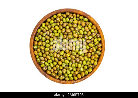 Top view or flat lay pile of fresh green raw mung beans in wooden bowl. Stock Photo