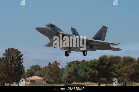 An F-22 Raptor assigned to the 422nd Test and Evaluation Squadron lands ...