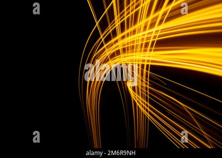 Abstract modern banner design. Glowing warm lines on black background. Stock Photo