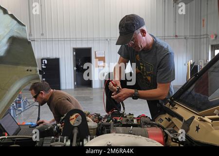 https://l450v.alamy.com/450v/2m6ra4k/us-army-reserve-staff-sgt-patrick-mccoy-assigned-to-the-282nd-engineer-company-416th-engineer-command-based-in-fort-carson-colo-and-a-military-technician-based-at-the-equipment-concentration-site-42-prepares-to-use-a-digital-multimeter-to-check-continuity-of-a-joint-light-tactical-vehicle-connector-while-staff-sgt-allan-zink-assigned-to-the-expeditionary-combat-aviation-brigade-based-in-fort-carson-and-a-military-technician-based-at-the-equipment-concentration-site-42-fort-carson-looks-on-a-laptop-to-tell-him-what-pin-will-be-tested-in-the-joint-light-tactical-vehicle-phase-one-c-2m6ra4k.jpg