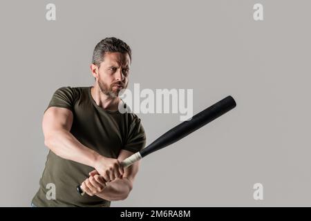 photo of angry man hold bat. angry man threatening with baseball bat. Stock Photo