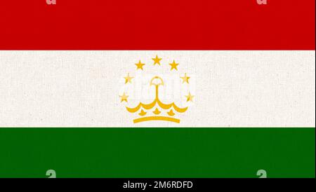 Flag of Tajikistan. Tajik flag on fabric surface. Fabric texture. National symbol of Tajikistan. Stock Photo