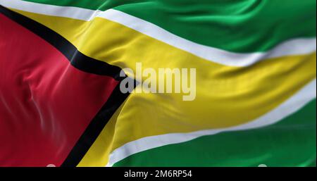 Close-up view of the Guyana national flag waving in the wind. The Coâ€‘operative Republic of Guyana is a country on the northern Stock Photo