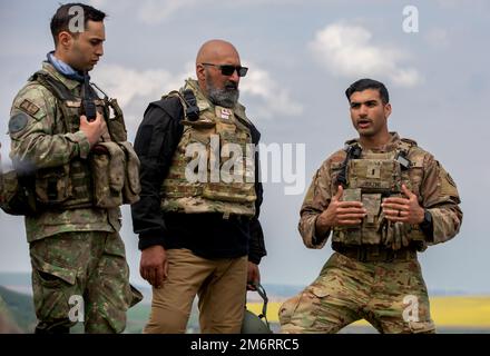 U.S. Army 1st Lt. Jafr Kazmi, an infantry officer assigned to 2nd Cavalry Regiment, conducts an after-action review during a Joint Live Fire Exercise in Babadag Training Area on May 4, 2022. 2nd Cavalry Regiment is among other units assigned to V Corps, America's forward deployed corps in Europe that works alongside NATO allies and regional security partners to provide combat-credible forces; executes joint, bilateral and multinational training exercises; and provides command and control for rotational and assigned units in the European theater. The United States and our NATO Allies and Partne Stock Photo