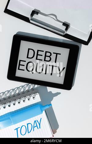 Text showing inspiration Debt Equity. Word for dividing companys total liabilities by its stockholders Stock Photo