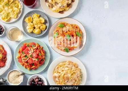 Italian pasta, various dishes, overhead flat lay shot with copy space Stock Photo