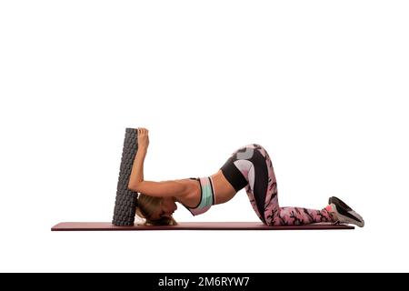 Anonymous woman doing plank exercise on mat Stock Photo