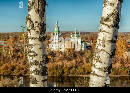 Two birch trunks against a blurred background of the Church of the Transfiguration of the Lord in Kungur. Photo taken in Kurgur, Perm Territory, Russi Stock Photo