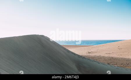 Sand dunes beach of Maspalomas Gran Canaria during sunrise Stock Photo