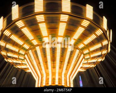Long exposure picture of a traditional fairground ride Stock Photo
