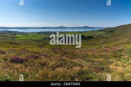 View of Bantry Bay and the village of Kilcrohane in western County Cork as seen from Seefin Mountain Pass Stock Photo