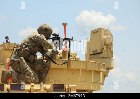 An M2A3 Bradley Fighting Vehicle crew heads to the range during gunnery ...