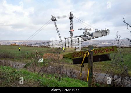 DISTANCE sign, opencast mine, bucket wheel excavator, general, feature, marginal motif, symbolic photo The village of Luetzerath on the west side of the Garzweiler lignite opencast mine will be cleared and dredged in January 2023, Luetzerath, 05.01.2023, Stock Photo