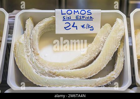Dried pieces of salted cod or bacalao, traditional Spanish delicacy for sale at a local market in the old town or Casco Viejo in Pamplona, Spain Stock Photo