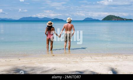 Koh Mak Thailand,a couple of men and woman on the beach, Panoramic view of idyllic Beach in Thailand Stock Photo