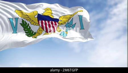 Flags of United States Virgin Islands waving in the wind with the US flag on a clear day Stock Photo