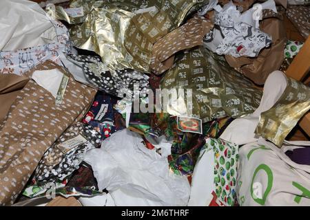 Crumpled up Christmas Wrapping Paper after opening Christmas Presents Stock Photo