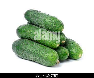 Bunch of ripe green cucumbers on a white isolated background Stock Photo