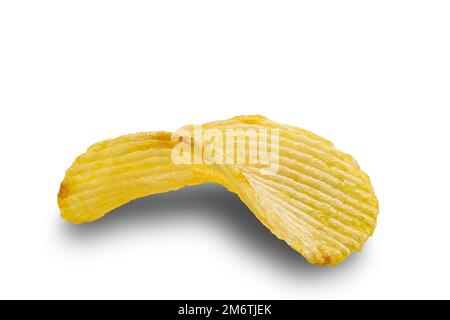Closeup view of single dry crispy salted potato chip isolated on white background. Stock Photo