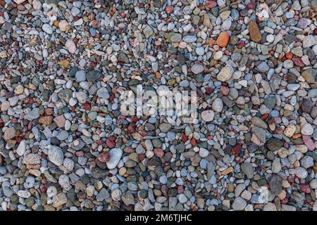 Background from stones. Natural stones of different colours. Top of view. Stock Photo