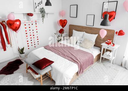 Interior of bedroom with gifts and balloons for Valentine\'s Day ...