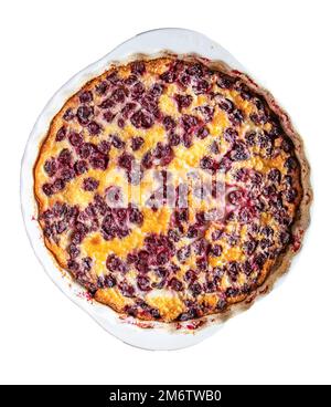 White round ceramic baking dish with freshly baked cherry pie CLAFUTI, top view. isolated on a white background Stock Photo