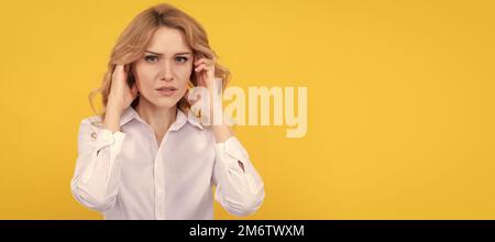 Unhappy ill woman touch ears suffering from ear pain yellow background, earache. Woman isolated face portrait, banner with mock up copy space. Stock Photo