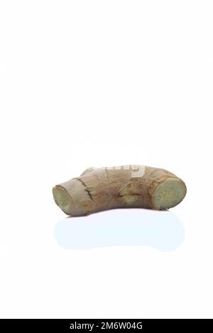 a piece of ginger in a peel isolated on white background. Stock Photo