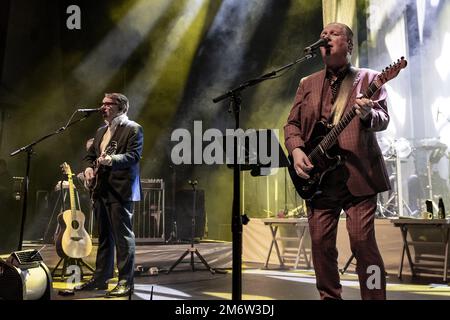 GUILDFORD, ENGLAND: Dr John Cooper Clarke and Squeeze perform on stage at G Live. Featuring: Chris Difford, Glenn Tilbrook Where: Guildford, United Kingdom When: 29 Nov 2022 Credit: Neil Lupin/WENN Stock Photo