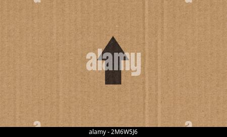 Black arrow on a cardboard box Stock Photo