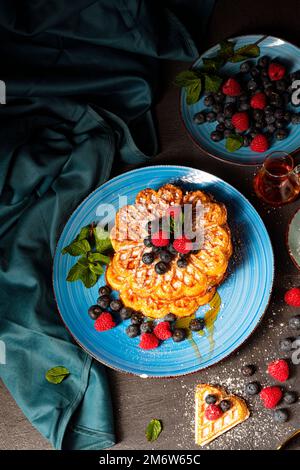 Simple sweet waffles with raspberries and blueberries Stock Photo