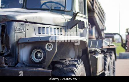 Soviet multiple launch rocket system BM-21 Grad on the chassis of a truck Ural-375D. Broken and burnt military equipment of the Stock Photo