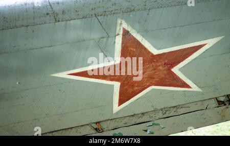 Identification mark of the Air Force of the Russian Federation, a five-pointed red star, bordered by a white stripe on an old So Stock Photo