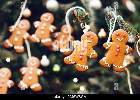 Gingerbread cookies hanging on Christmas tree Stock Photo