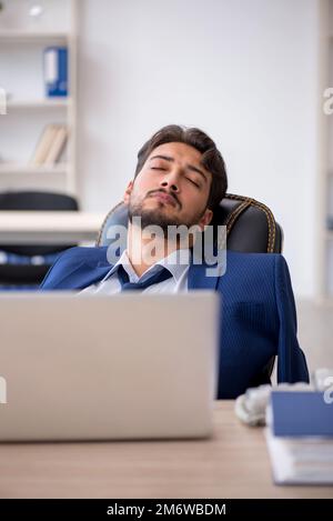 Extremely tired businessman male employee in the office Stock Photo Alamy