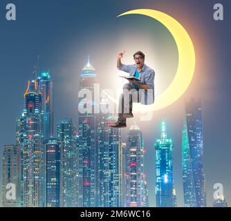 Student reading book on the moon crescent Stock Photo