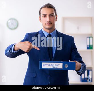 Young male accountant working in the office Stock Photo