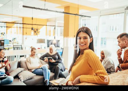 Multiethnic group of employees working in a marketing company. A group of colleagues is working on a project in modern offices Stock Photo
